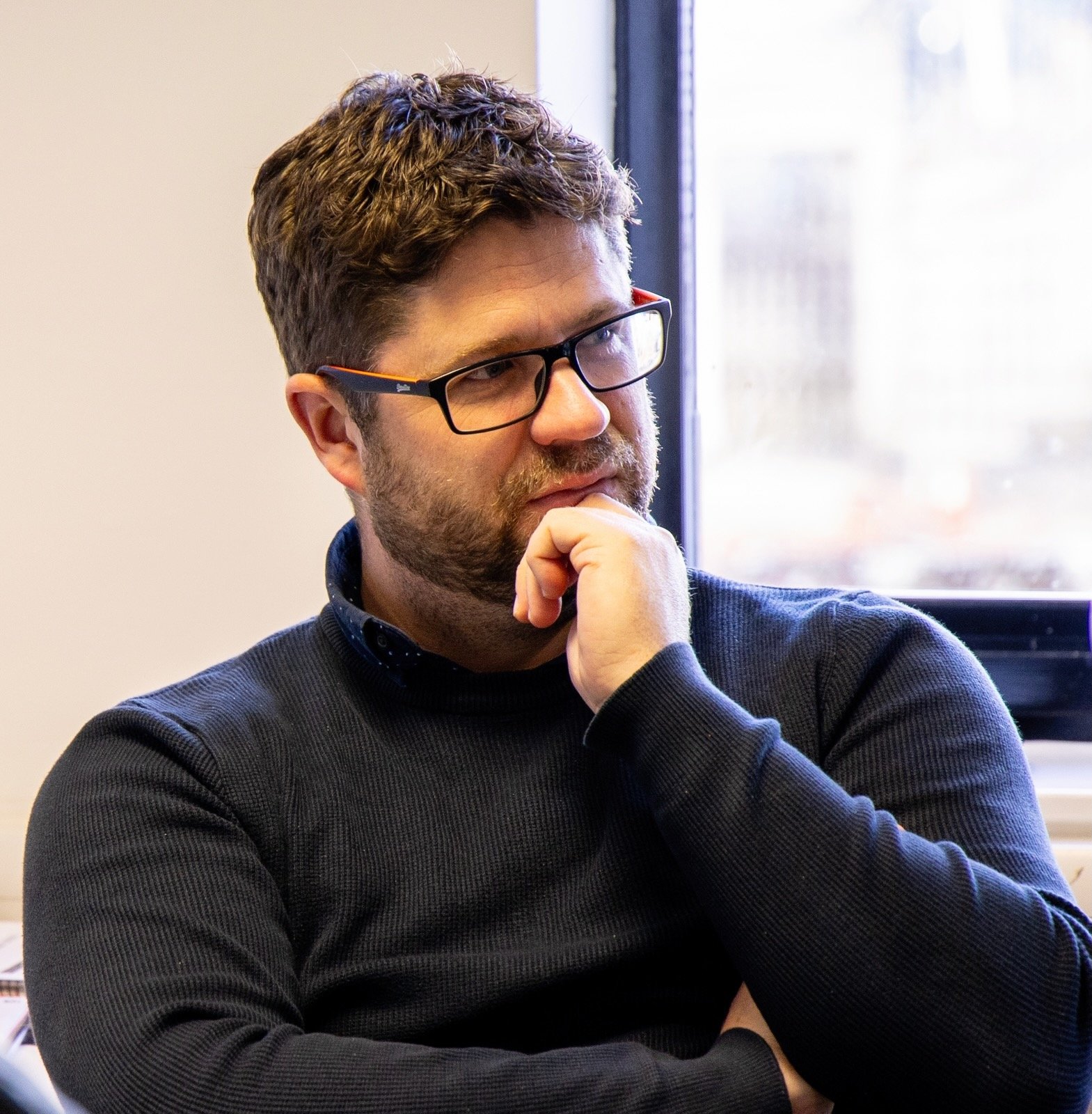 Mivida team member looking thoughtful